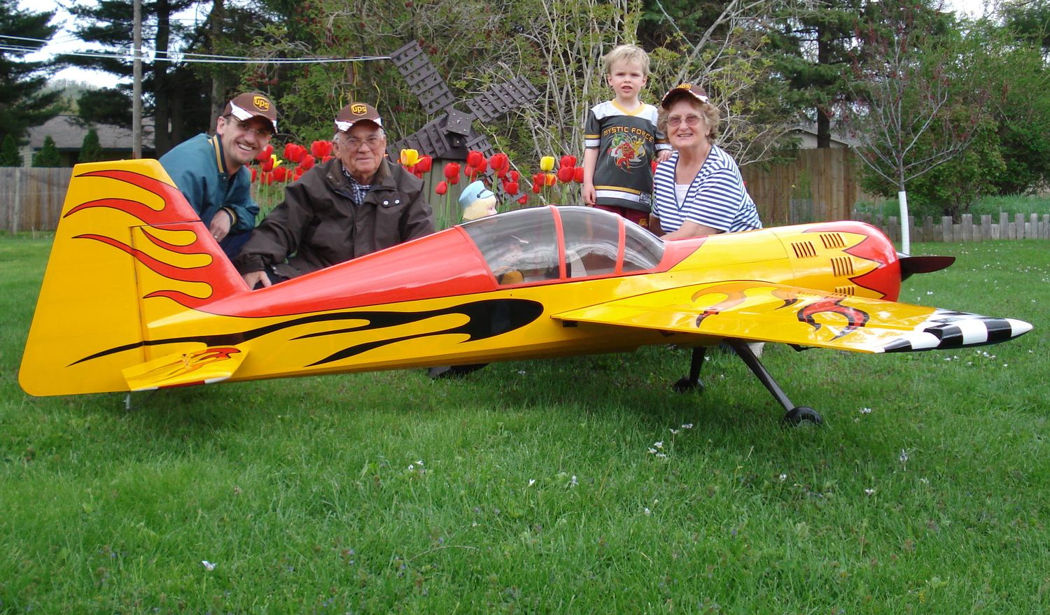 Family poses with Radio Control Airplane