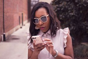 Lifestyle image of Female influencer with sunglasses