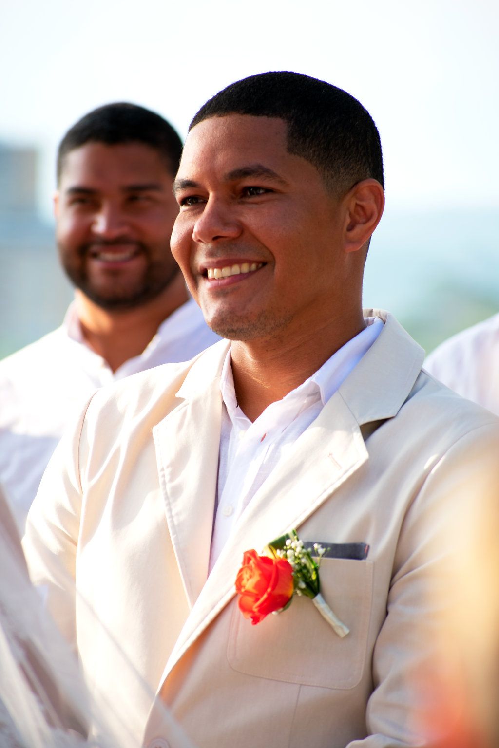 Groom smiling as he gets married