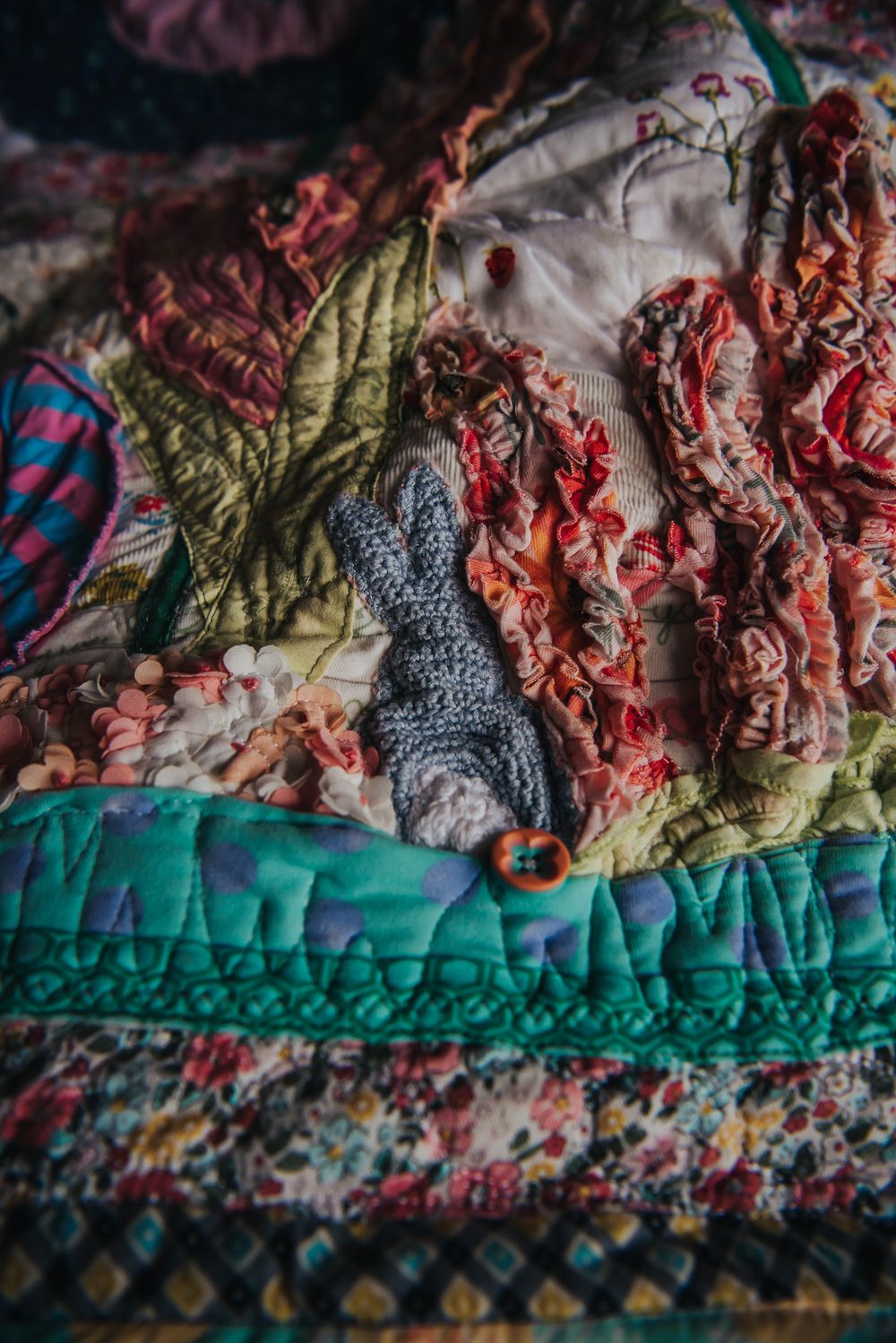Bunny applique facing away on a memory quilt.