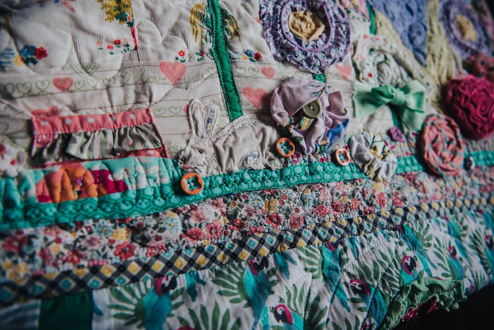 Memory quilt made with baby clothes.