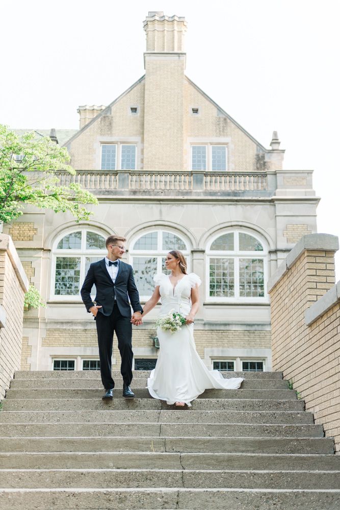 Indianapolis Indiana wedding photographer captures bride and groom on Laurel Hall stairs Jayme Riggleman Photography