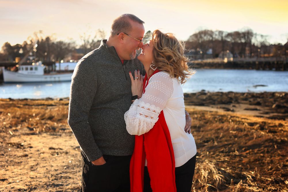 love portraits, engagement photography, couple photographer in Portsmouth New Hampshire. older couple cuddling in the su