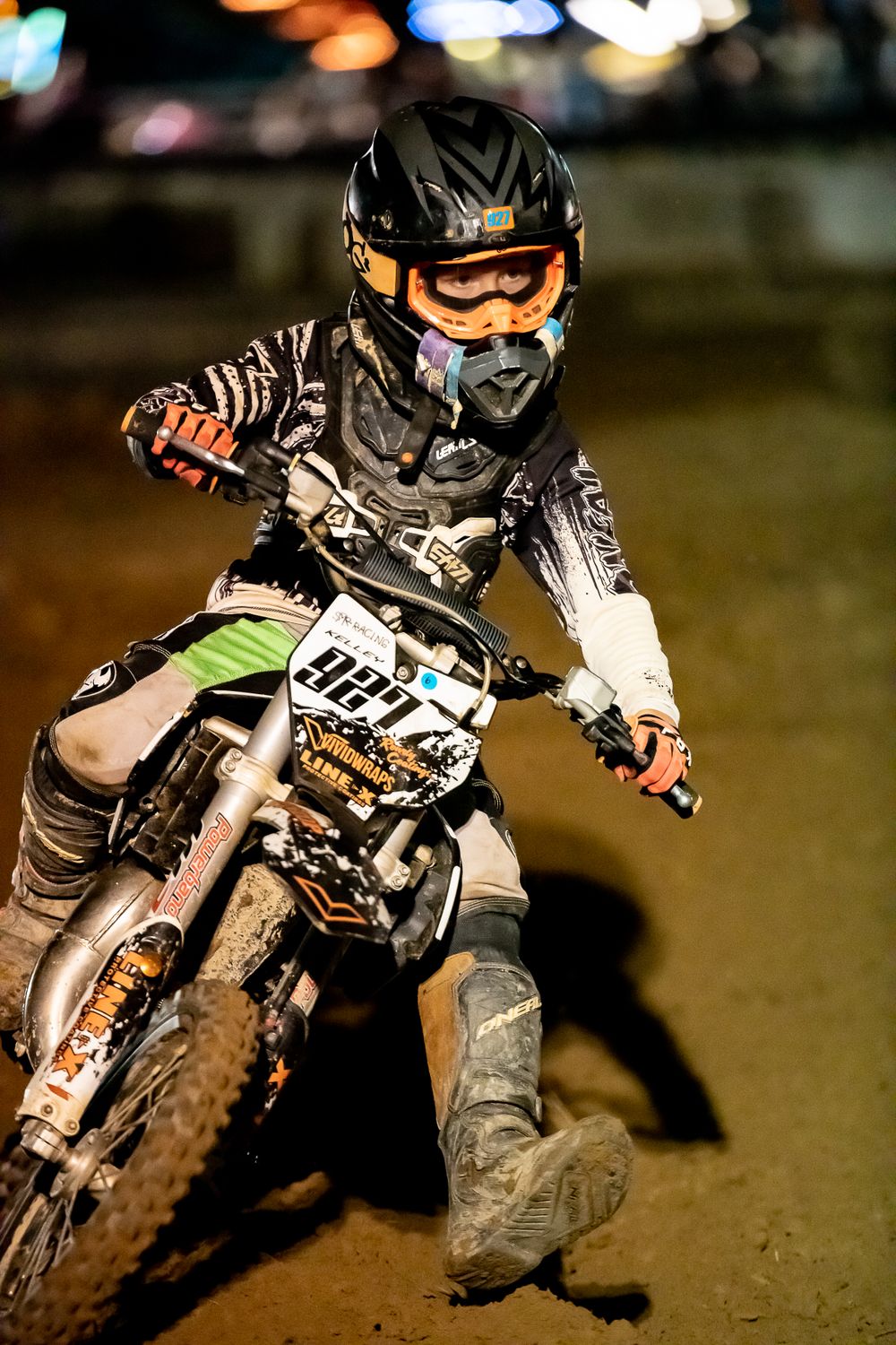 Night motocross racing sequence showing rider navigating through dark conditions.