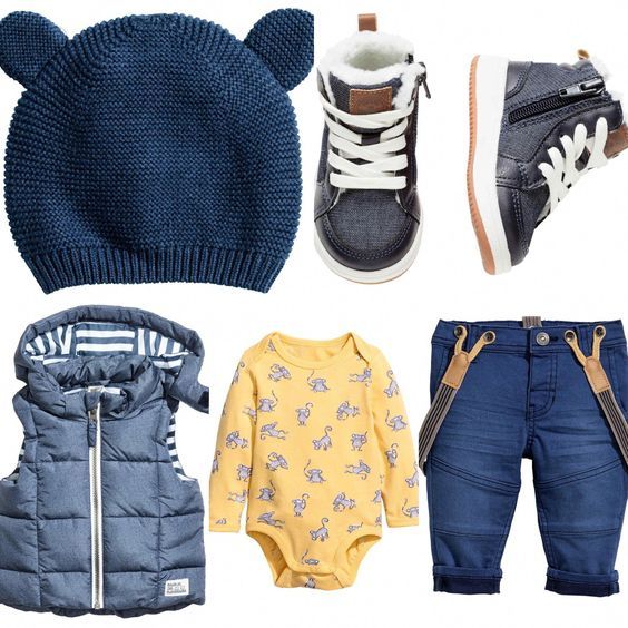 Baby fashion outfit set with navy beanie, puffy vest, yellow onesie and jeans with accessories.