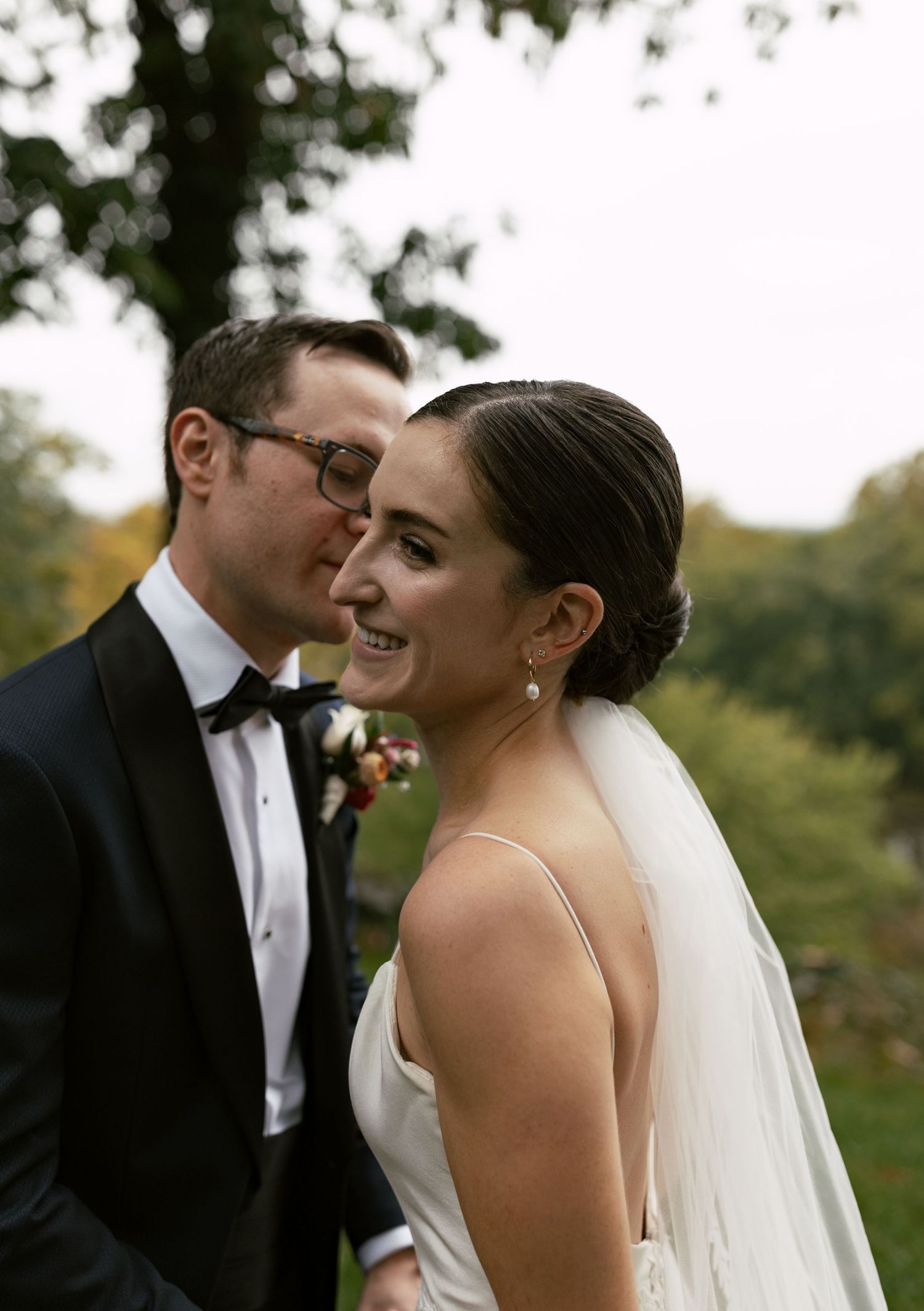 Romantic outdoor wedding portraits showing joyful moments between newlyweds.