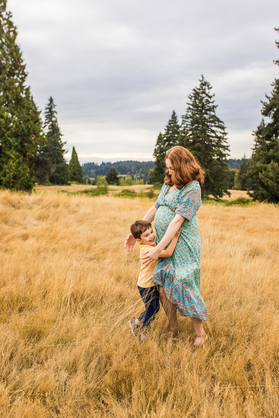 Bellevue family photographer captures son smiling while running to hug his mom