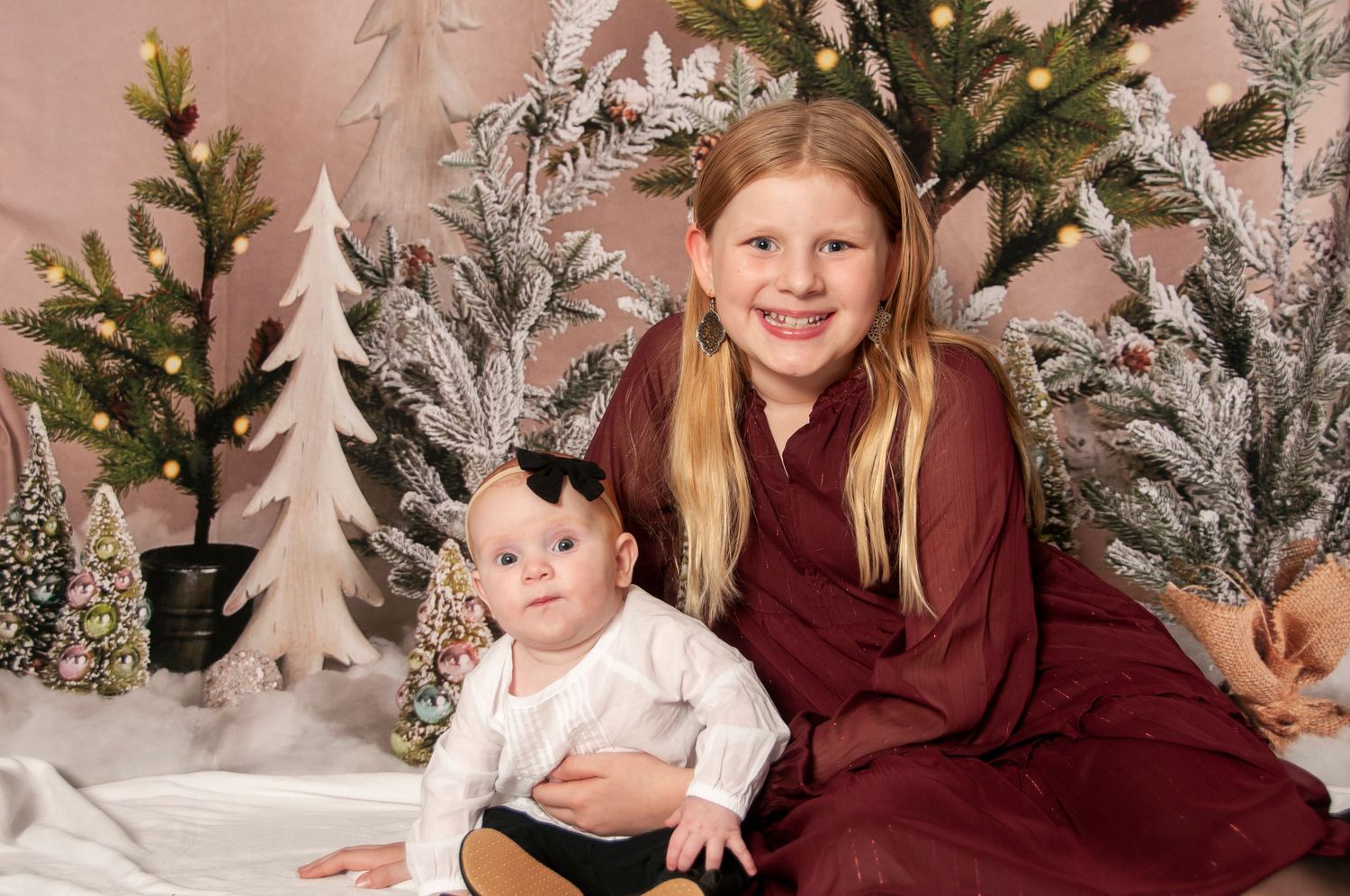 Sisters on holiday tree backdrop