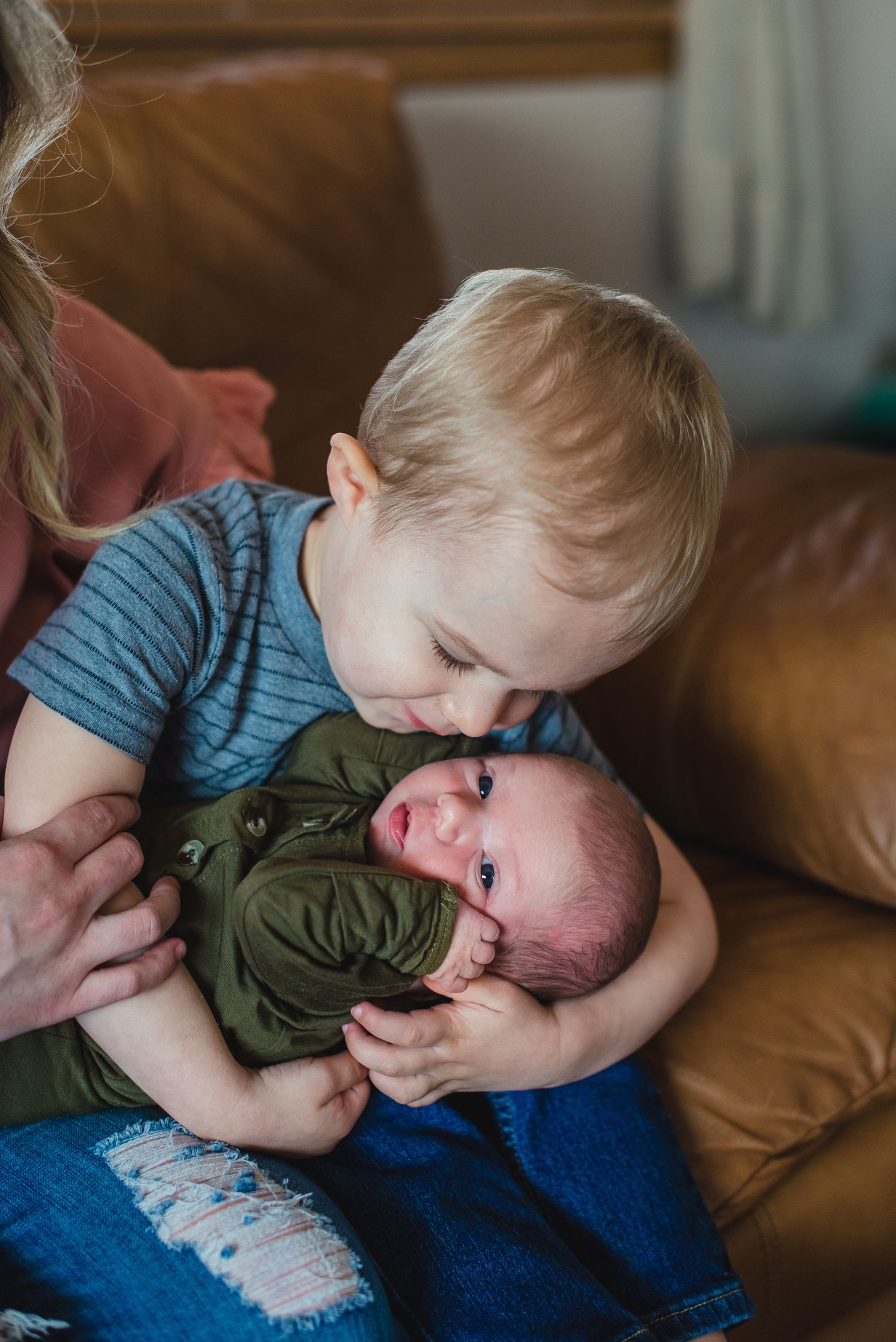 In-home lifestyle newborn family photo session by Wichita photographer