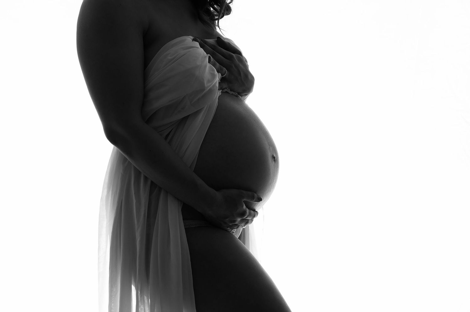 black and white close up of pregnant belly