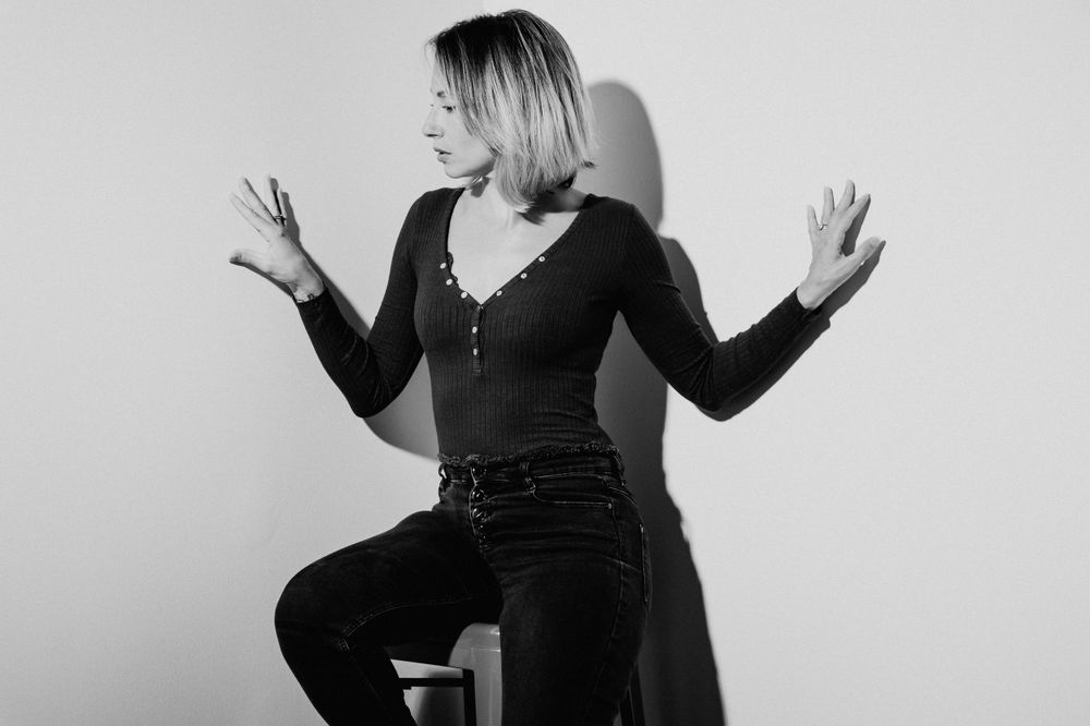 Black and white photo series showing expressive body language and gestures against white background.