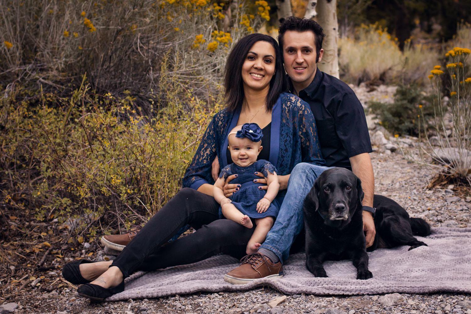 Family with baby and dog. Smiling and sitting on a blanket in the mountains. Las Vegas Photographer