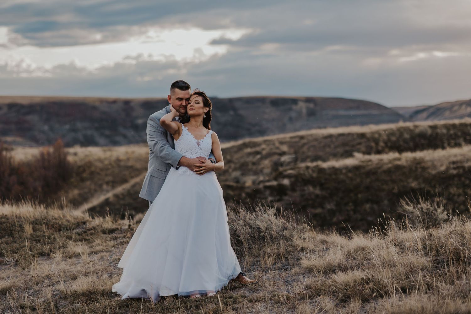 Bride and groom embrace in Drumheller Alberta