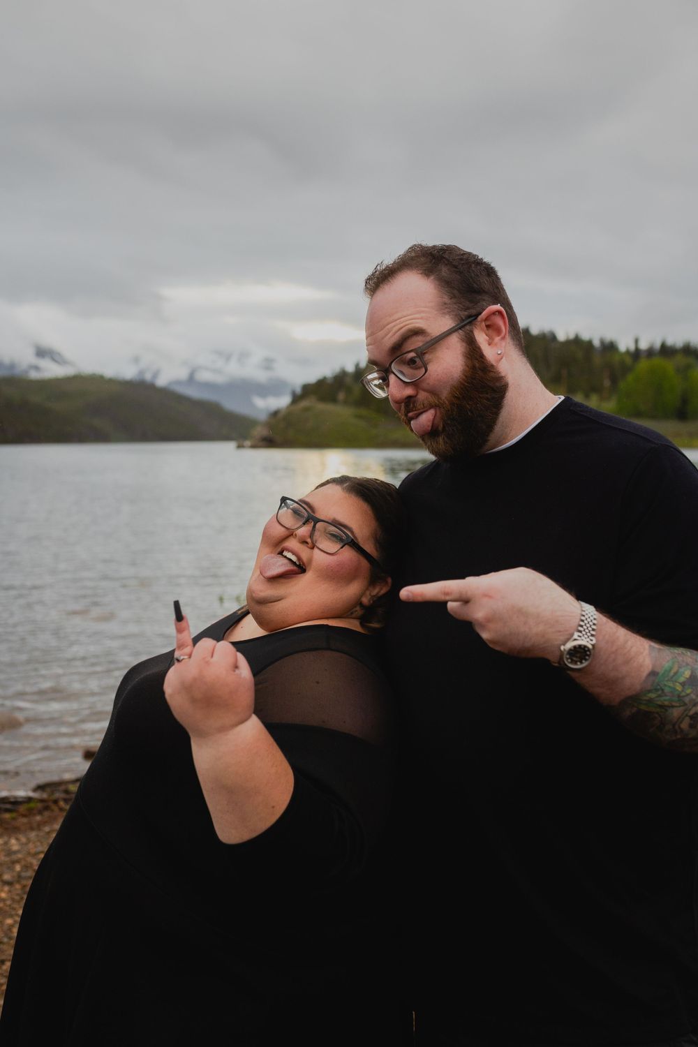Couple's laughter and smiles captured in their engagement photos captured by a Rocky Mountain elopement photographer