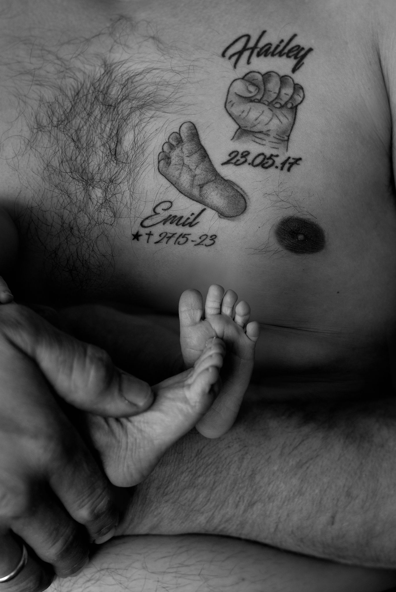 Series of black and white photos showing baby footprint tattoos with dates.