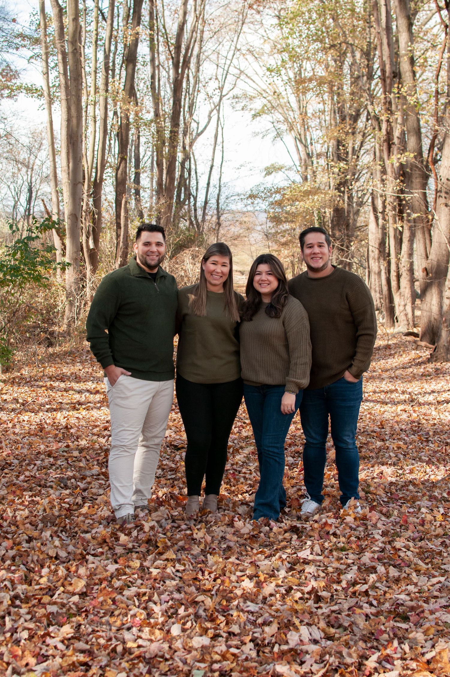 two couples together in fall foliage