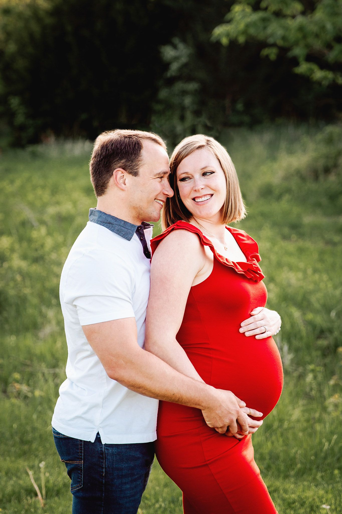 couple smile at each other during their photoshoot in shawnee mission park