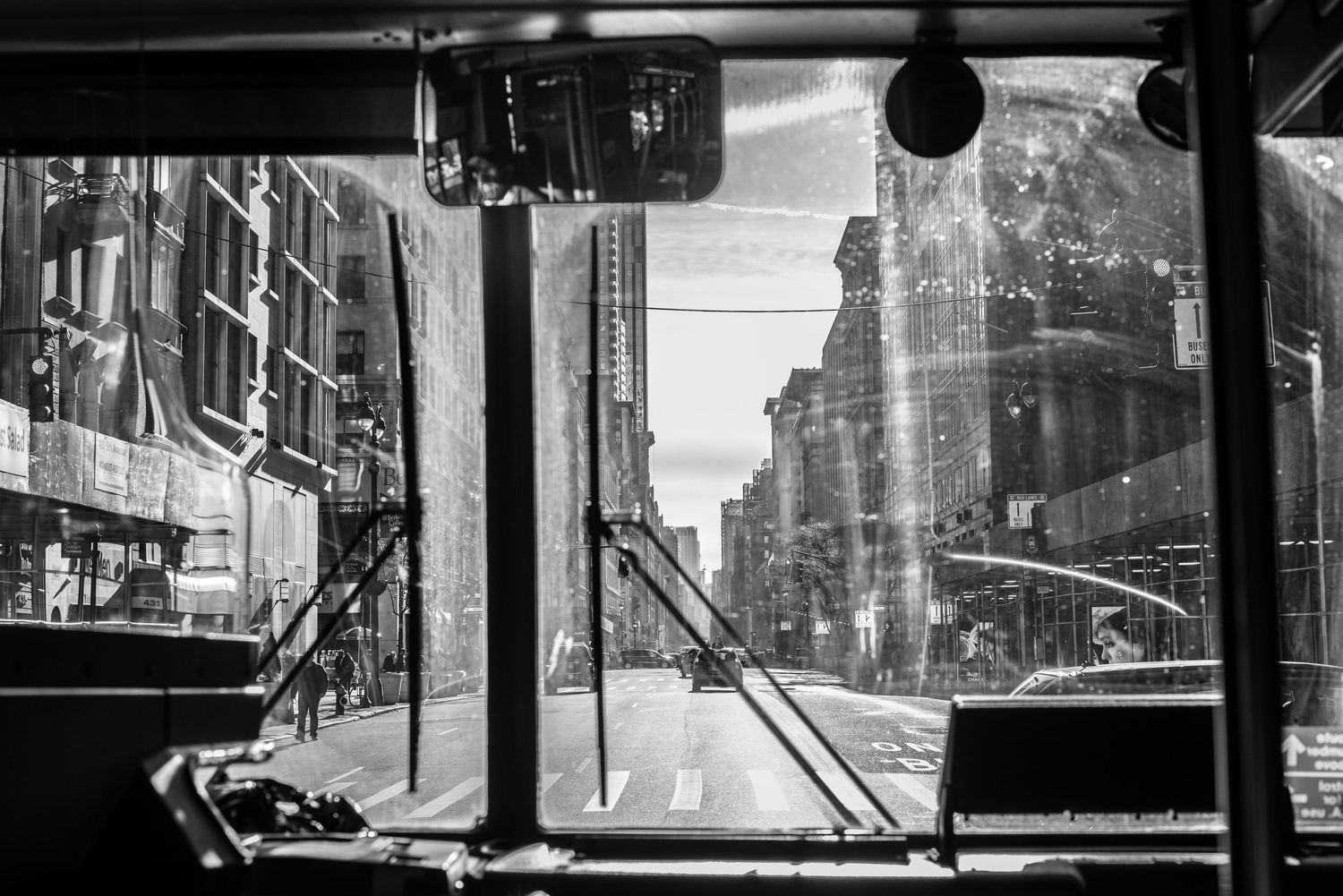 Looking through the front window of a bus driving down 5th ave, NYC