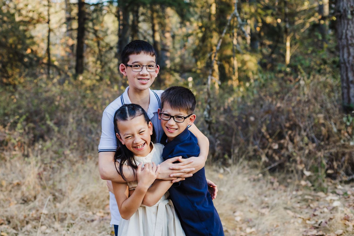 Siblings sharing playful moment together outdoors in casual setting.