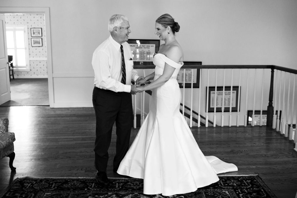 Bride and father share a moment before her wedding at Chagrin Valley Hunt Club.