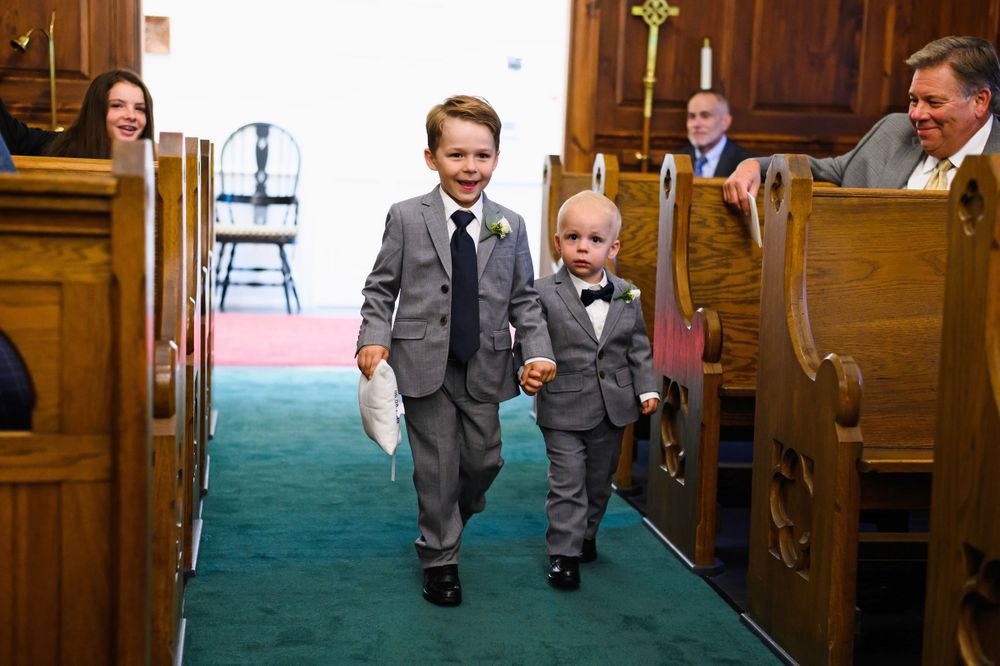 Ring bearers walk aisle at St. Huberts in Kirtland Hills, Ohio.