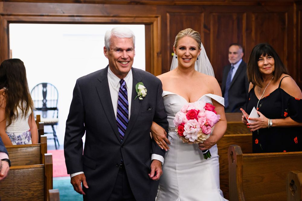 Father and bride walking down aisle at St. Huberts Episcopal Church in Kirtland Hills, Ohio.
