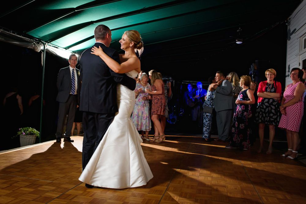 Bride and groom enjoy first dance during wedding reception at Chagrin Valley Hunt Club.