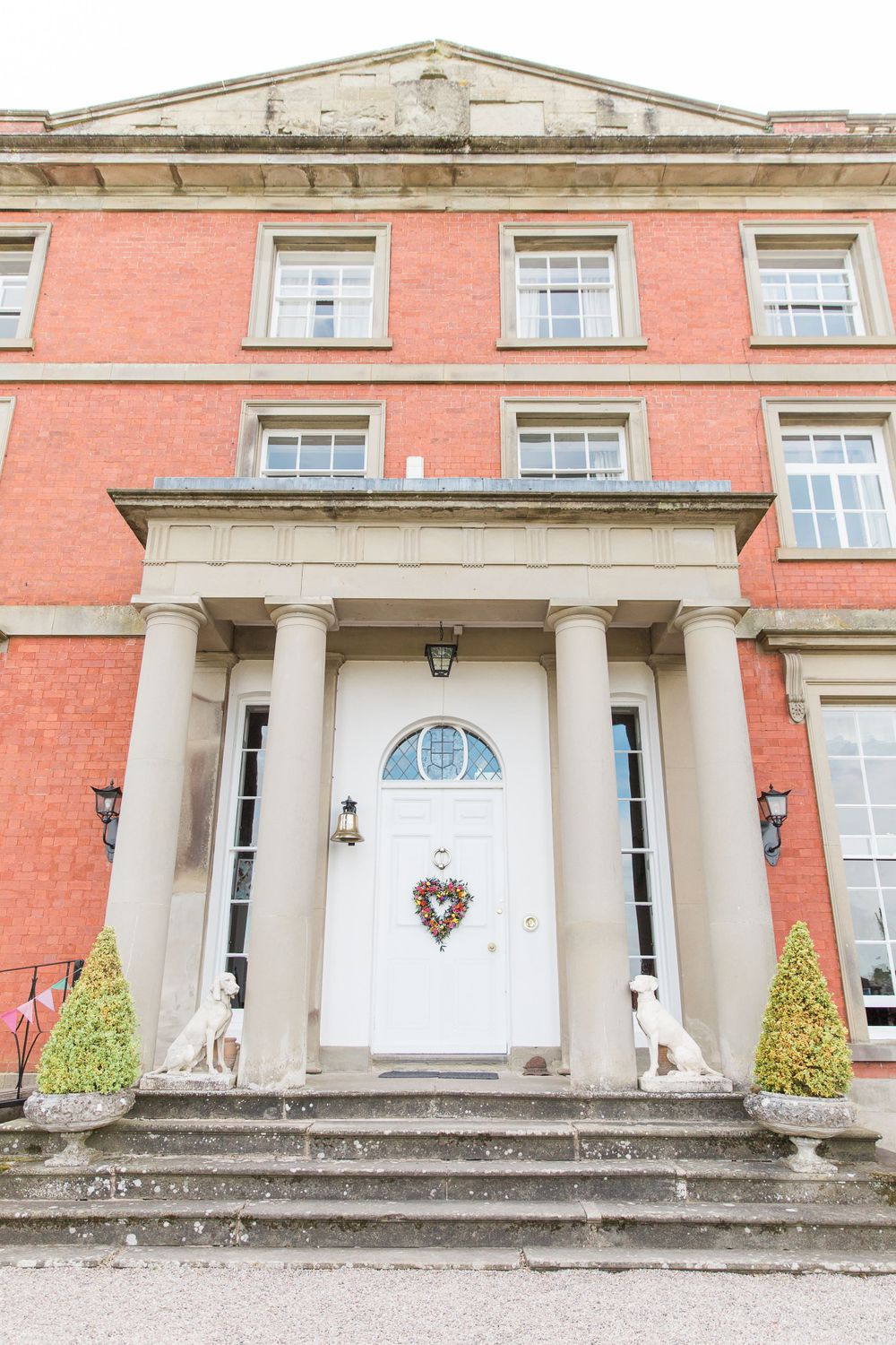 Hayley Elizabeth Photography Homme House Wedding Photographer West Midlands Micro wedding house with florals at door