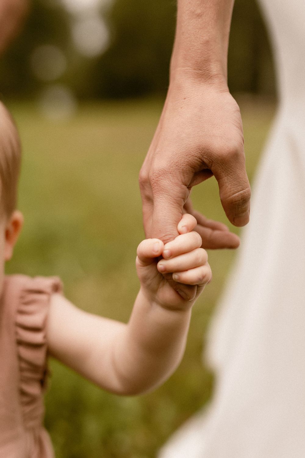 Edmonton Family Photographers.  Edmonton pre wedding Family Photographers. baby hand holding moms hand