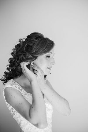 Elegant wedding hairstyle with curls styled in romantic updo.