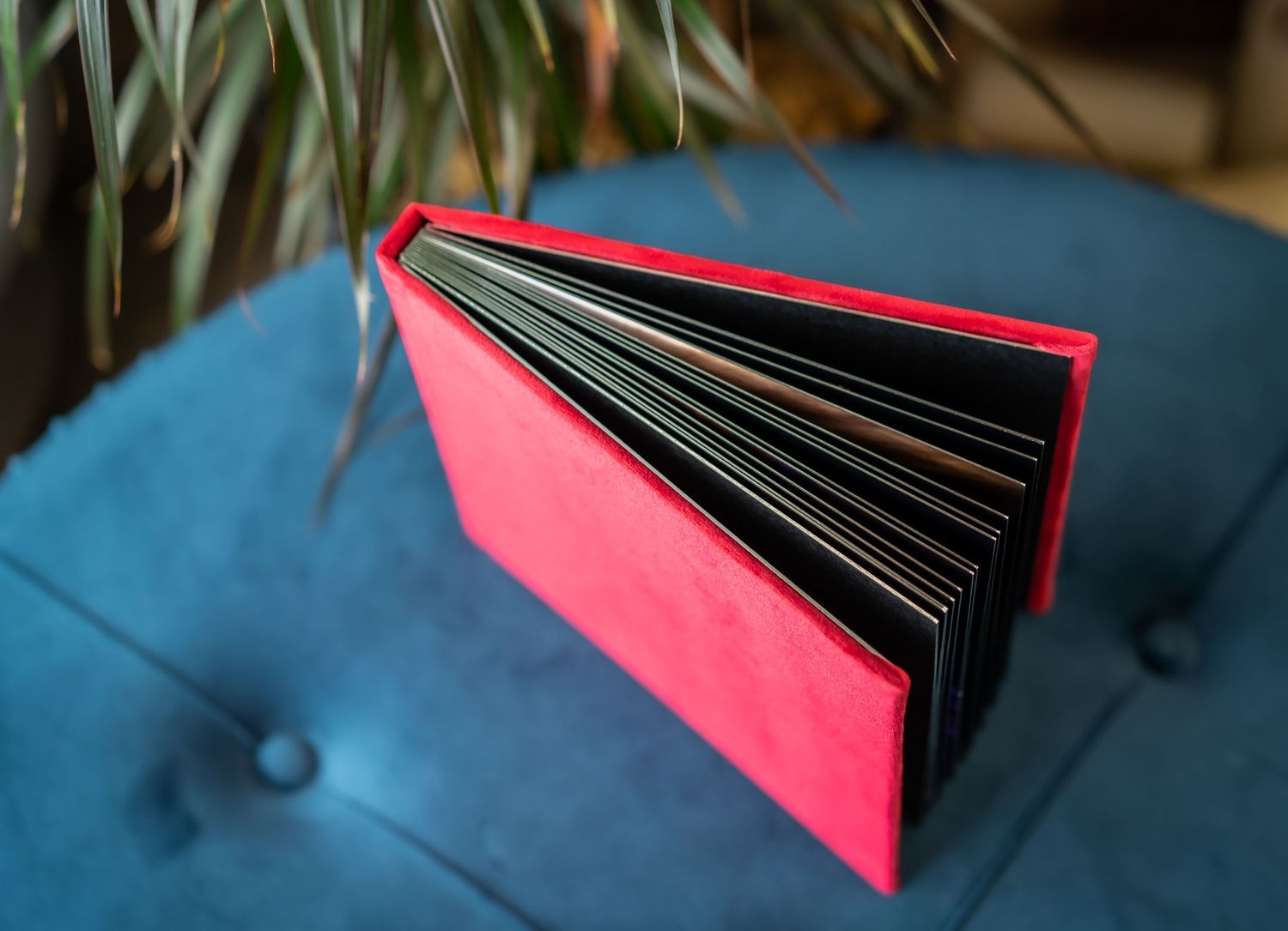 red custom album sitting on a blue stool