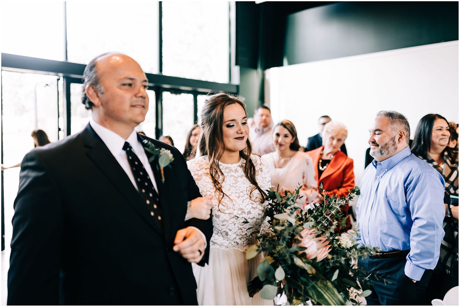 bride walking down aisle with dad