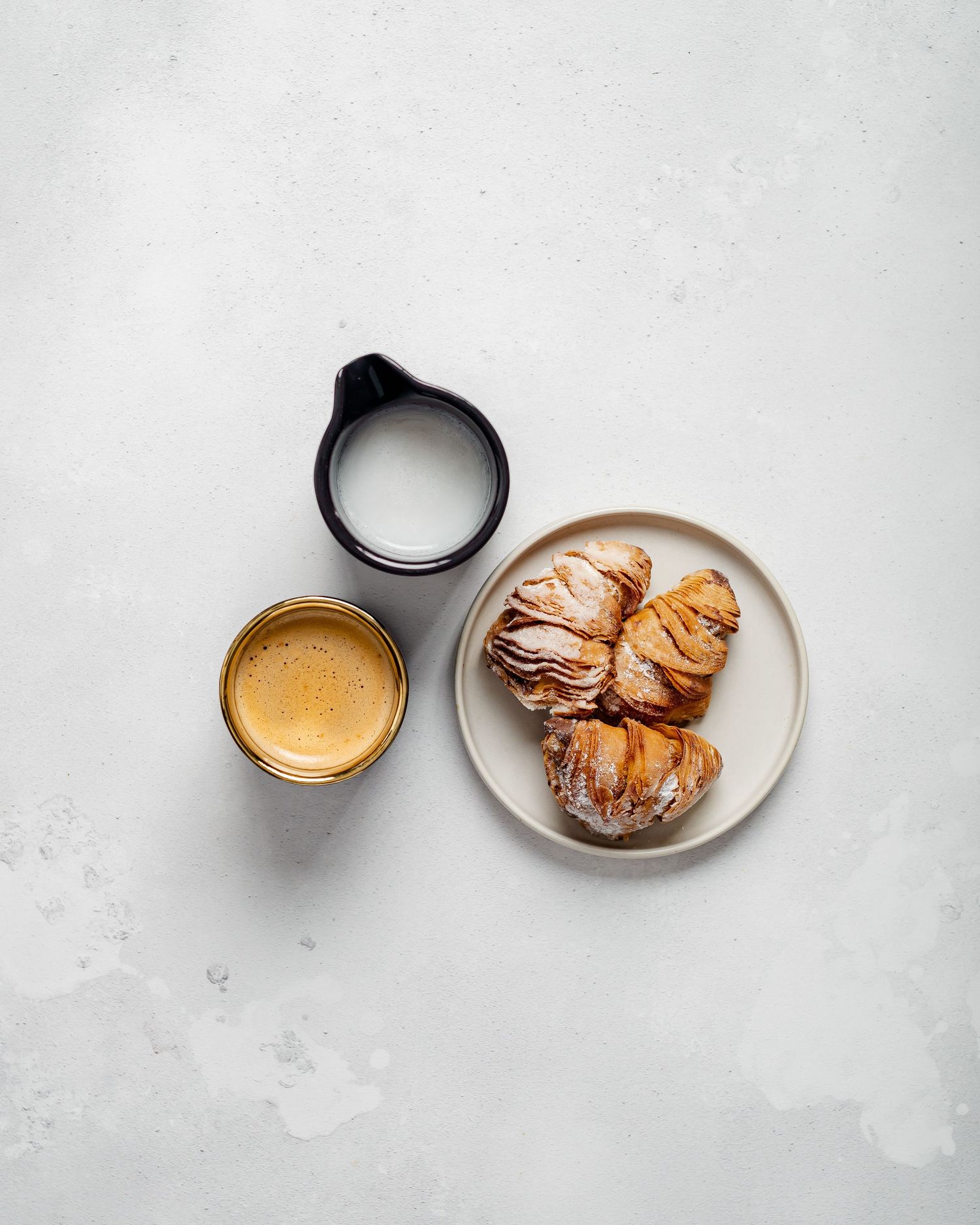 coffee, milk, pastries on white background. food photography, stylish, minimal