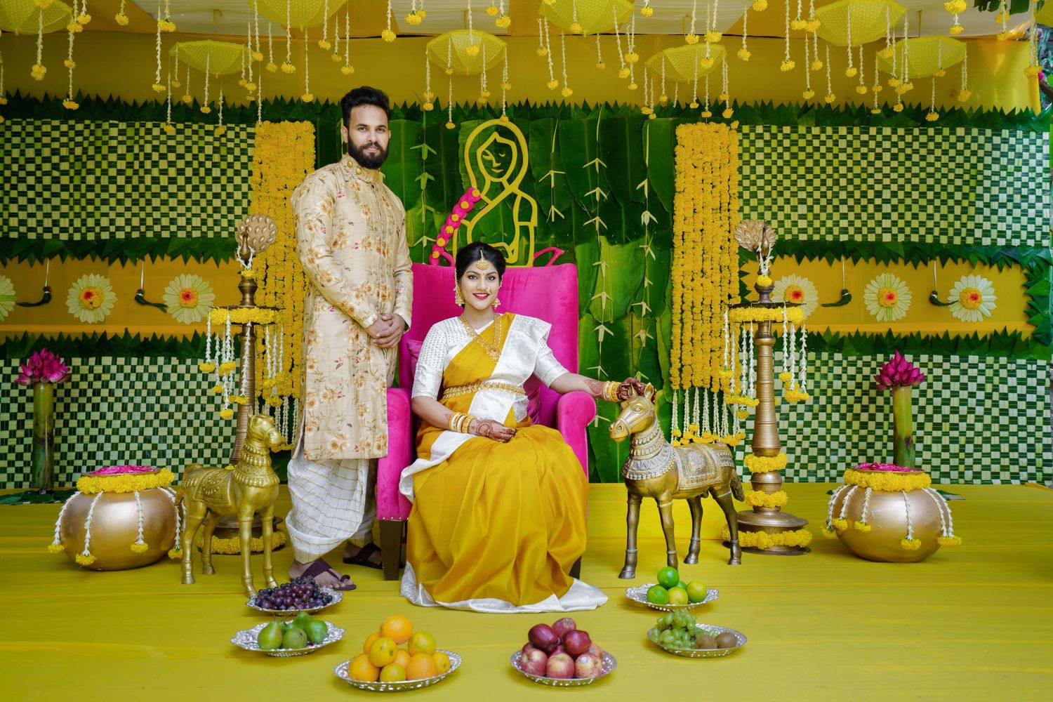 Baby shower couple portrait of a 9 months pregnant woman with royal and beautiful baby shower decor in hyderabad