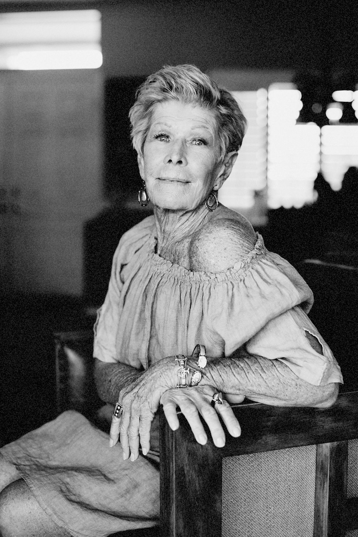 Vintage-style black and white portraits showing relaxed poses on wooden furniture.