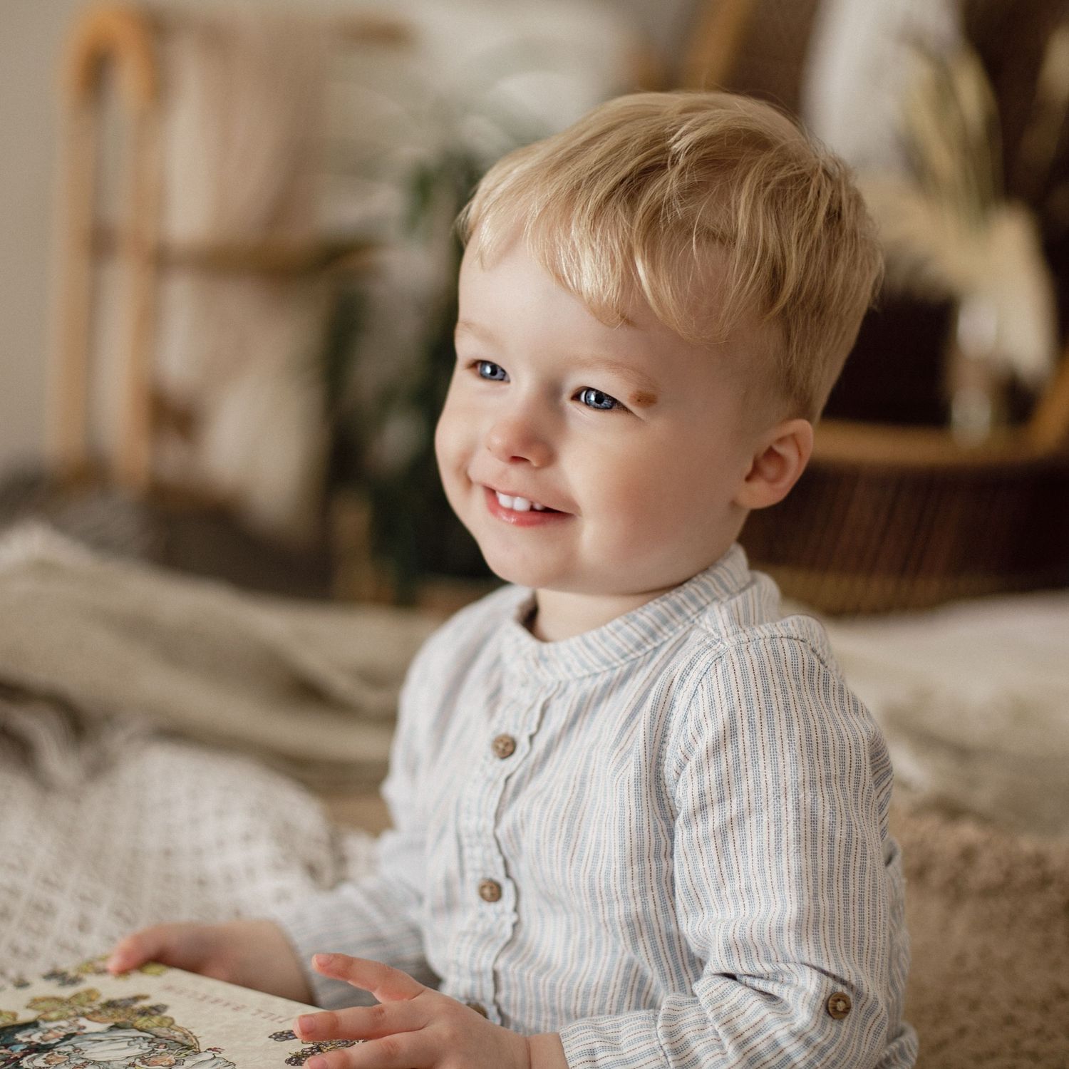 A boy enjoying his book. Sweet smile, Baby photoshoot.