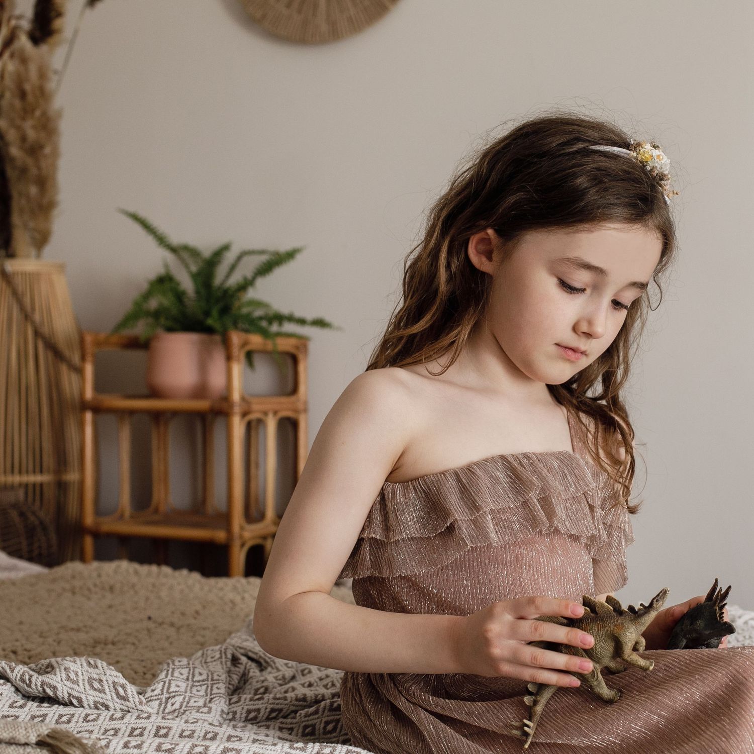 Lifestyle Photography Suffolk, Little girl playing with dinosaurs.