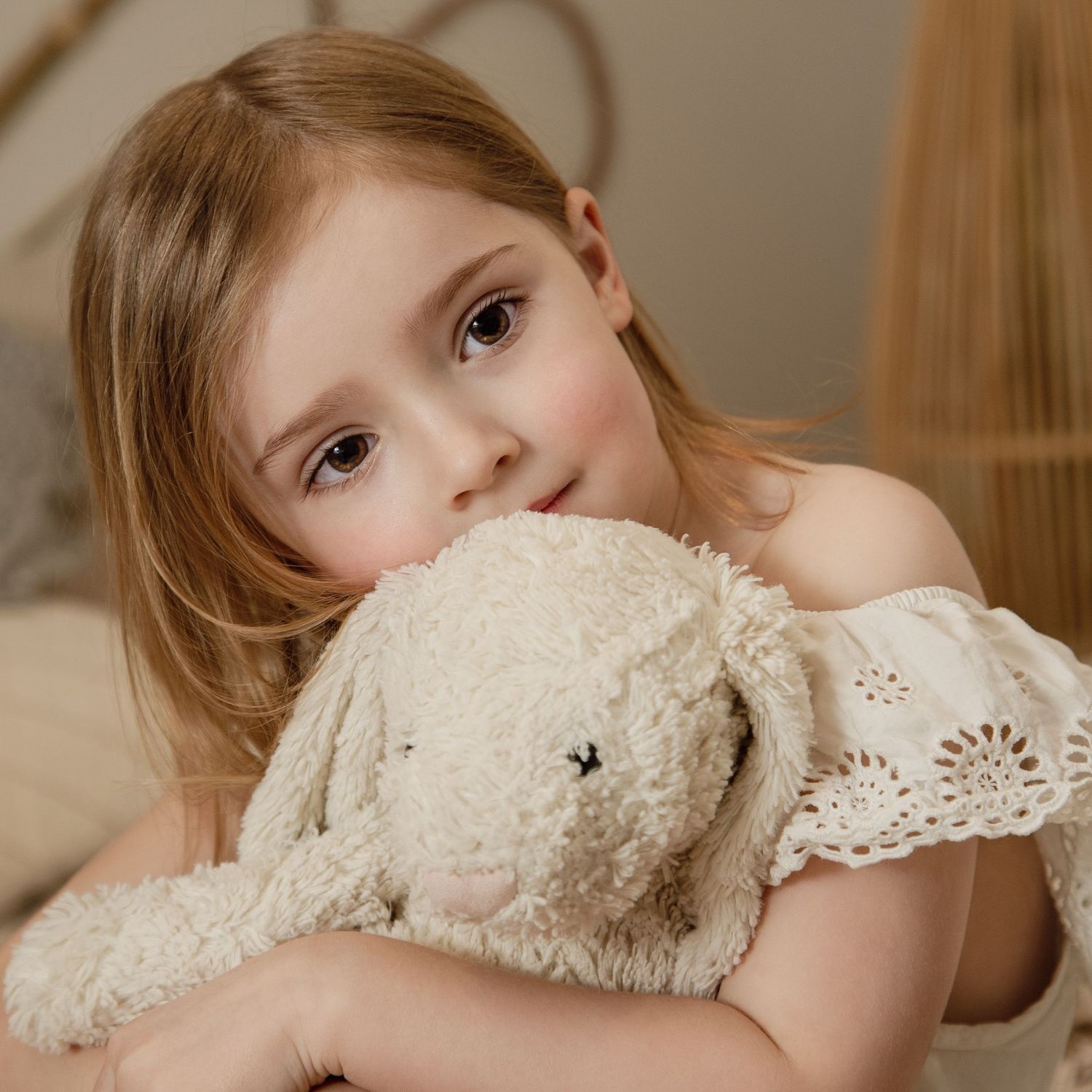 Children's Photography on Poppy way. Little girl holding her bunny.