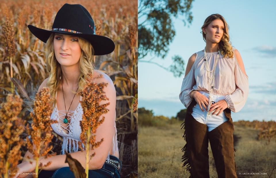 Western-inspired fashion shoot in field with black hat and countryside setting.