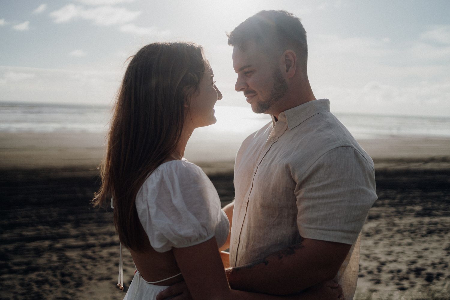 Engaged couple in Karioitahi Beach for their engagement shoot with Apertured Media-Auckland Wedding Photographer