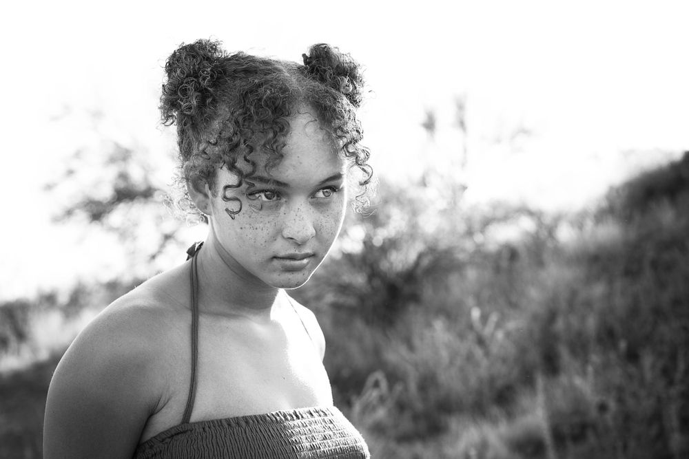 Artistic black and white close-up portrait in natural lighting.