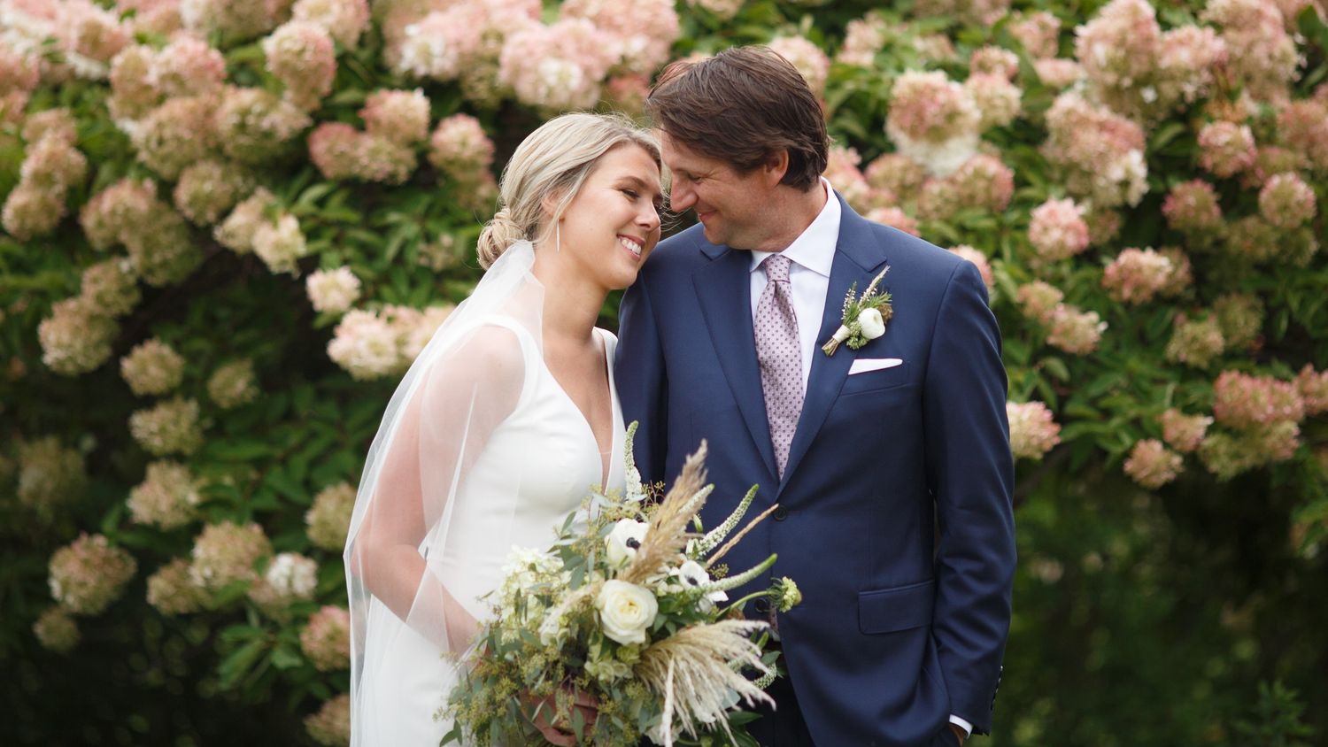 Maine Wedding couple embrace at Chebeague Island Inn