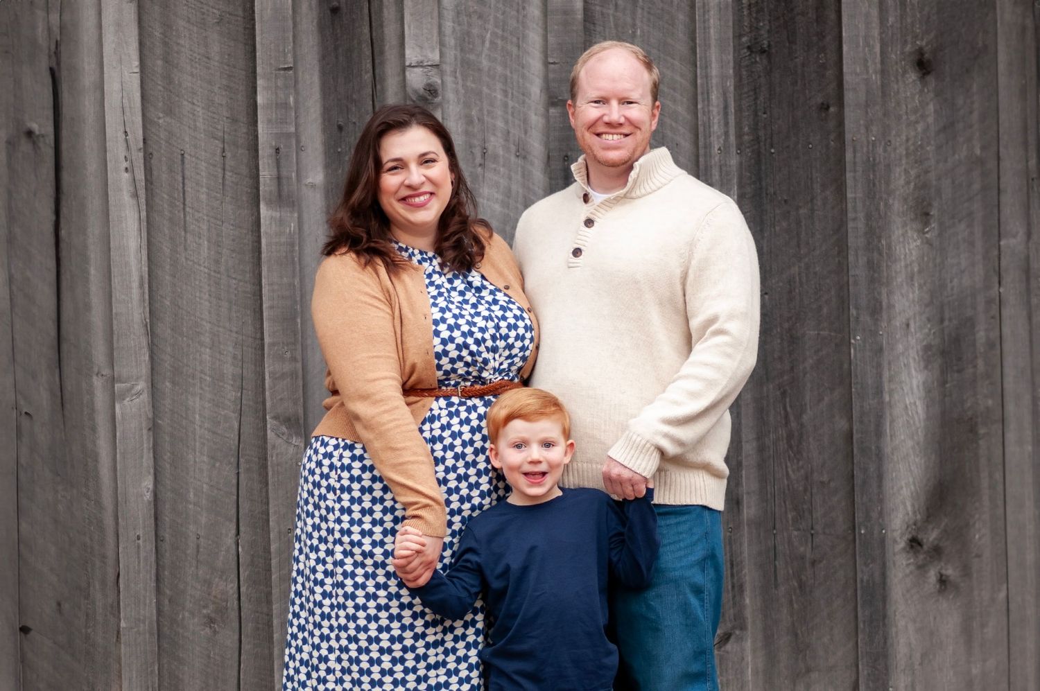 family photo standing holding hands