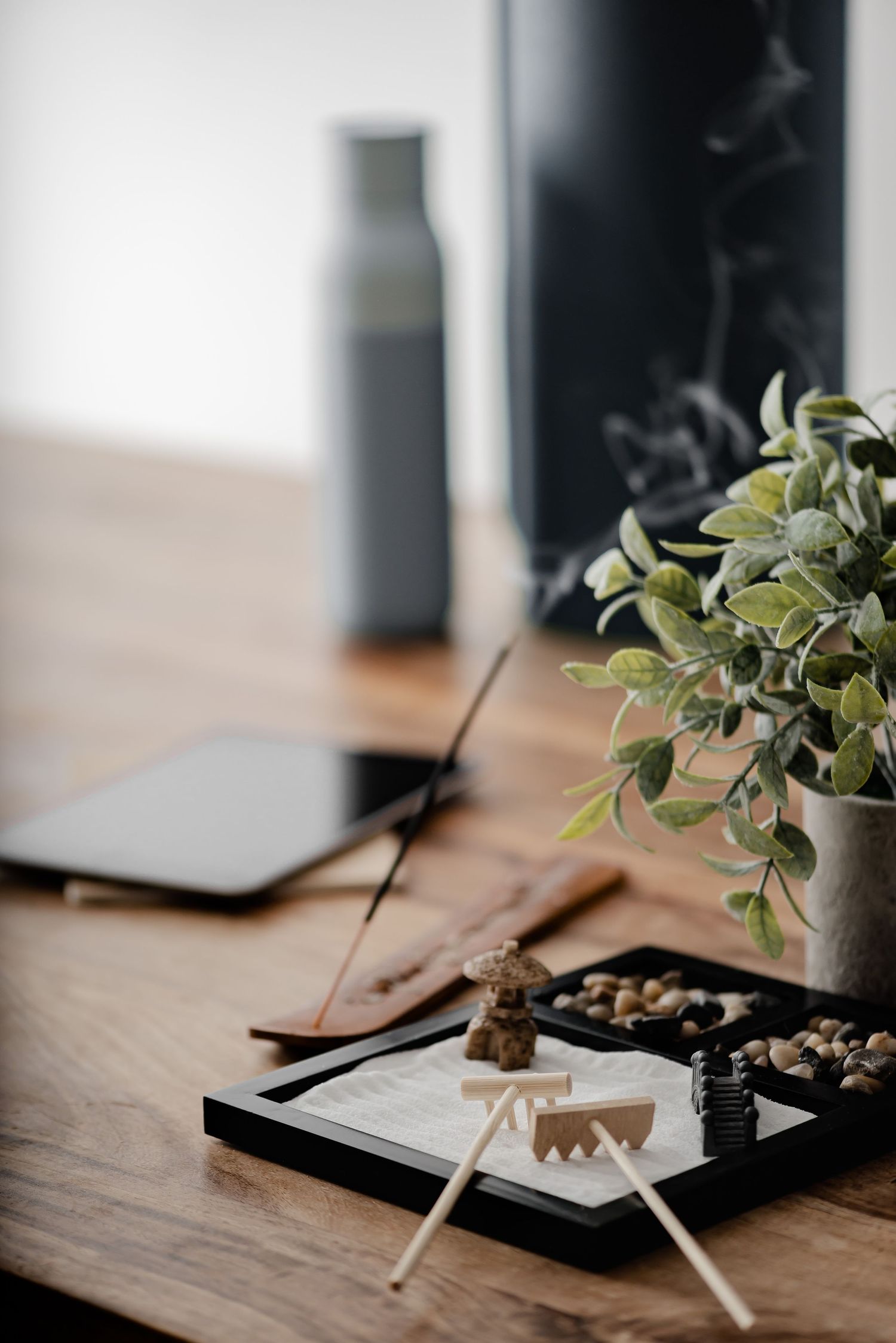 zen sand raking desktop ornament with plant and reed diffuser, mindfulness, slow living, blogs, stock photos