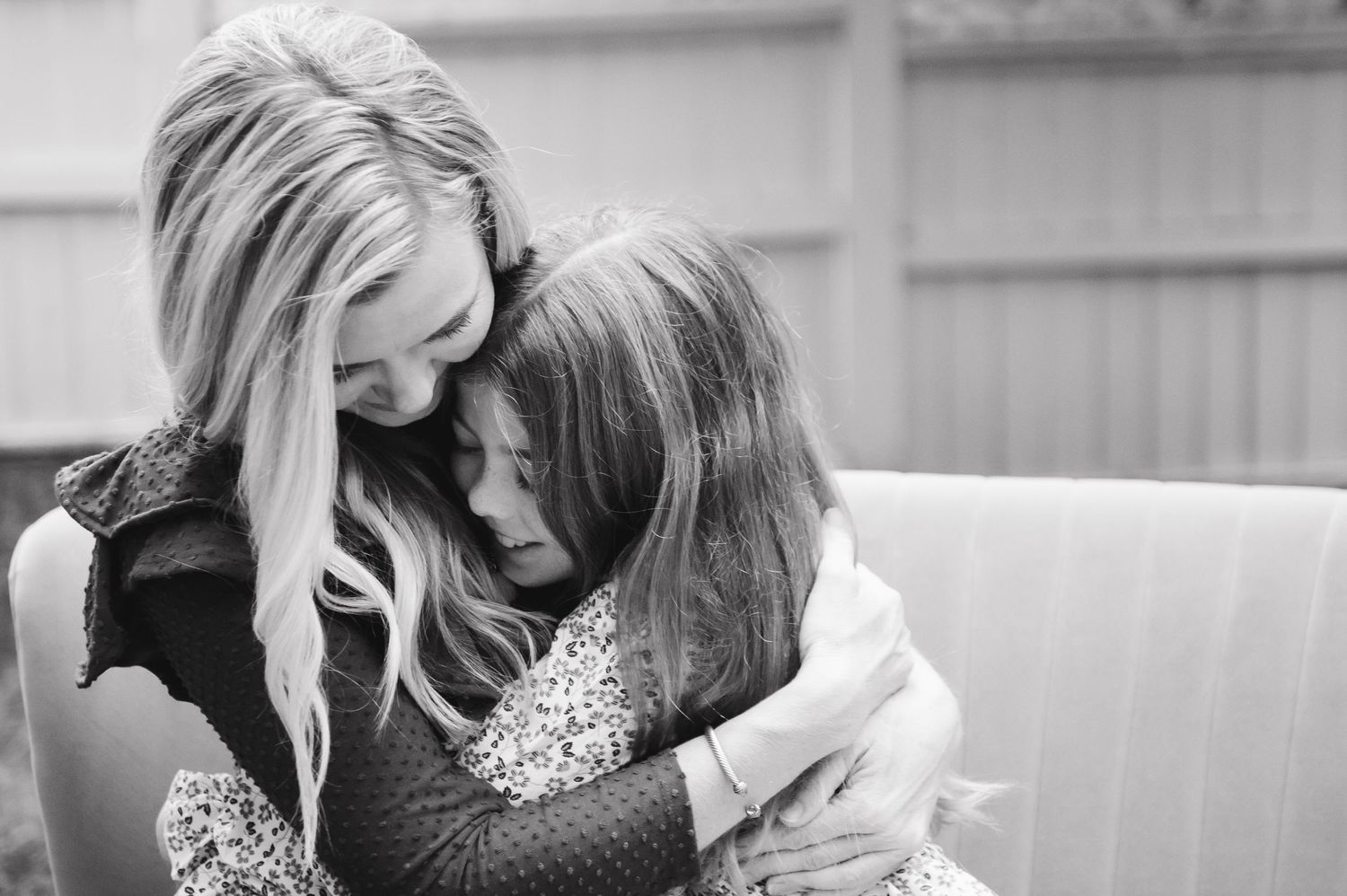 Black and white photo series showing intimate emotional moments between two people.