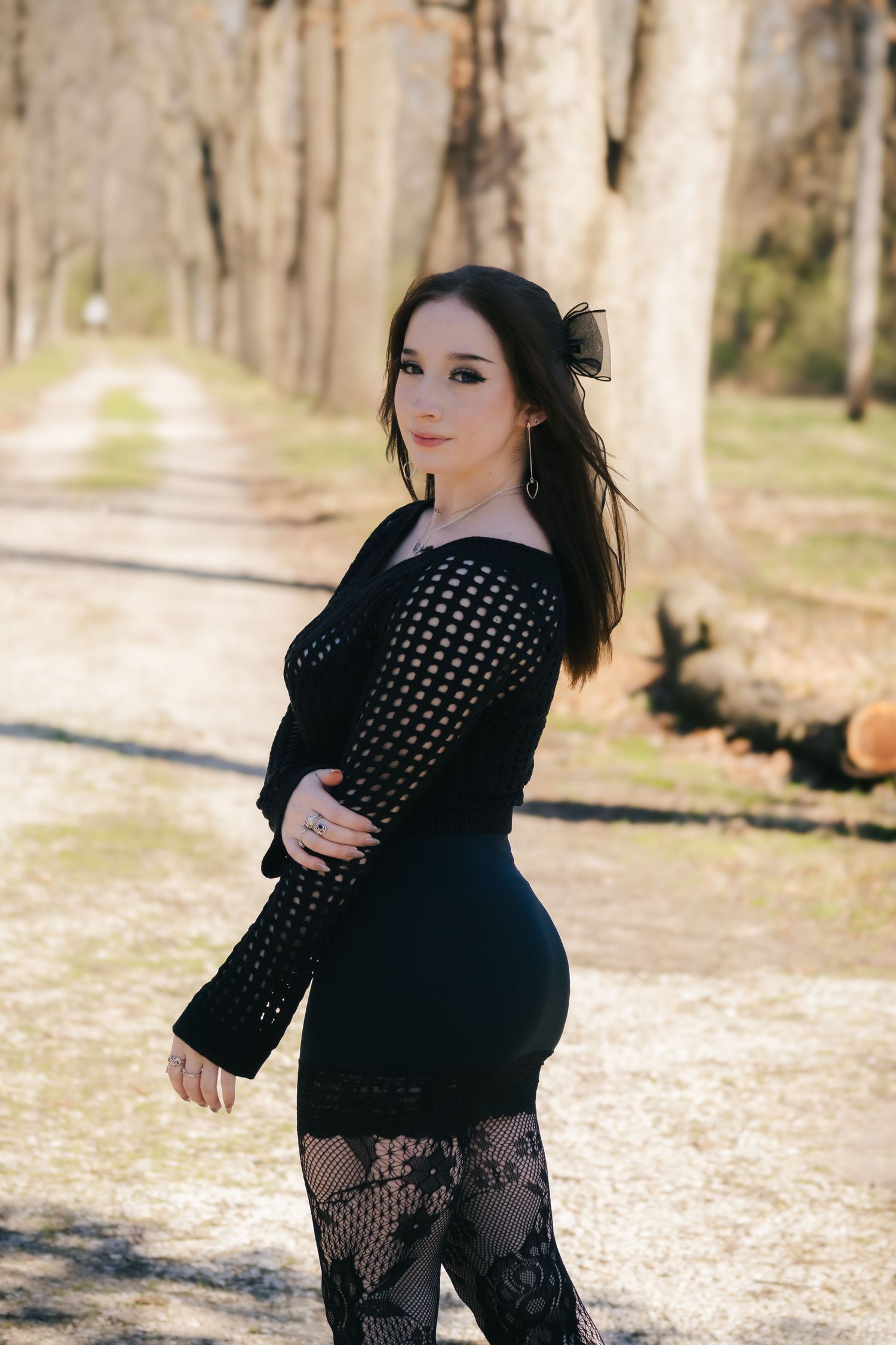 Outdoor spring senior photos at Lincoln Memorial Gardens in park in Springfield, Illinois
