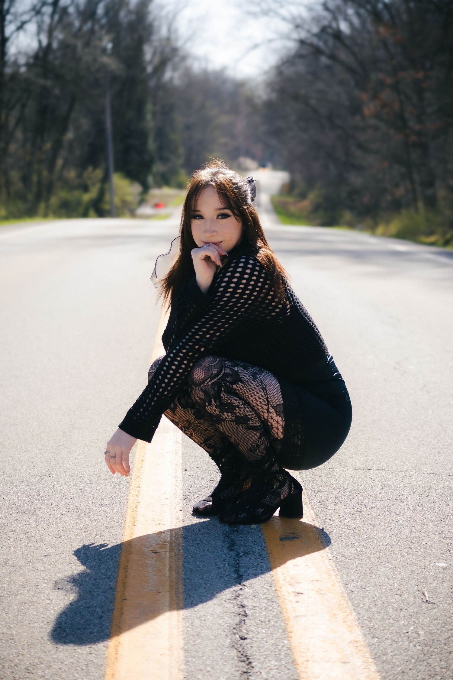 Outdoor spring senior photos at Lincoln Memorial Gardens in park in Springfield, Illinois