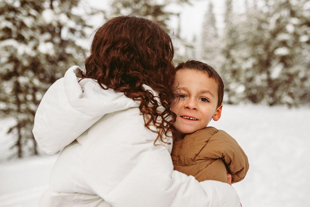 Photo of two children embracing each other by Kristy Baker Photography, a local Steamboat Springs, Colorado photographer.