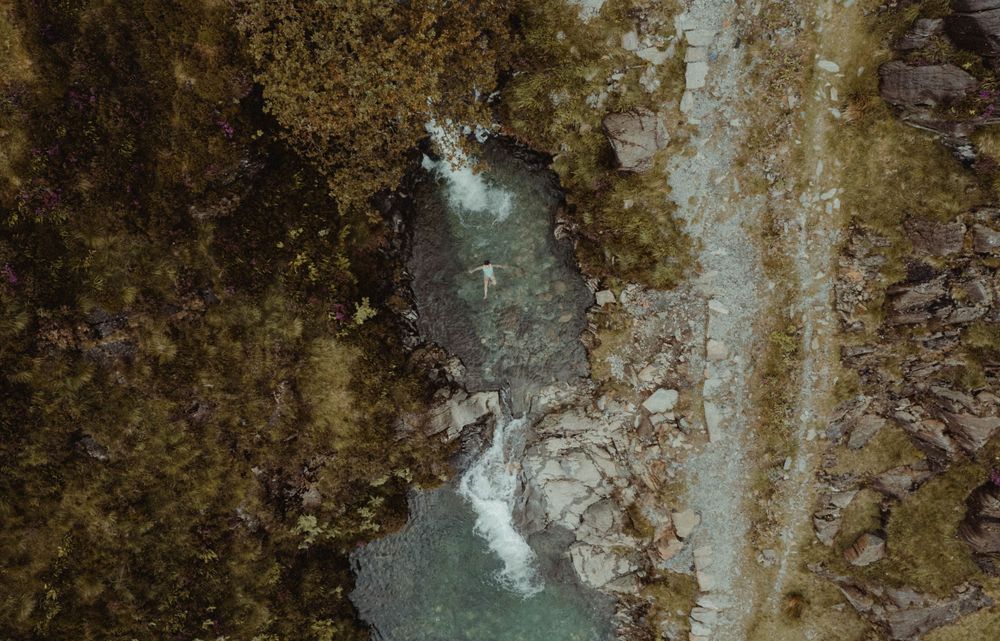 overhead shot of woman in river