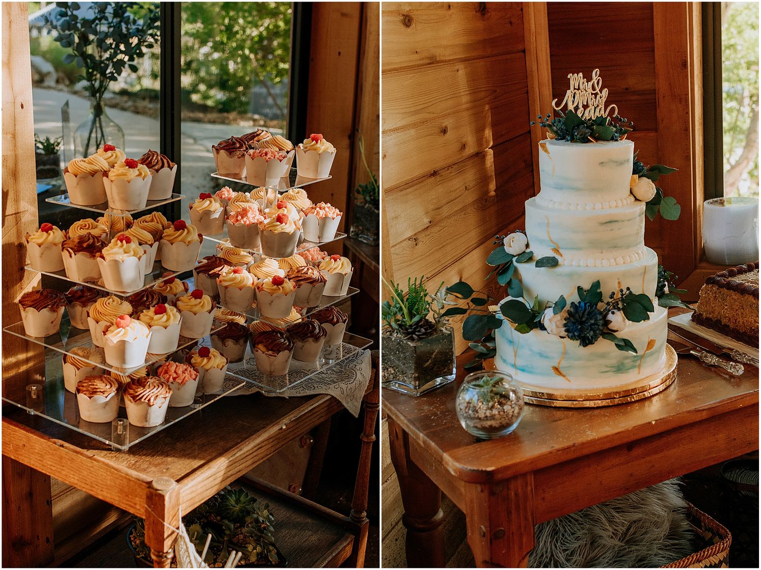 Wedding dessert display featuring cupcakes and a tiered white cake decorated with blue accents.